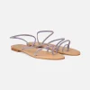 Flache Ringsandalen mit lila Strasssteinen
