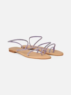 Flache Ringsandalen mit lila Strasssteinen