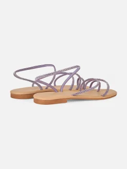 Flache Ringsandalen mit lila Strasssteinen