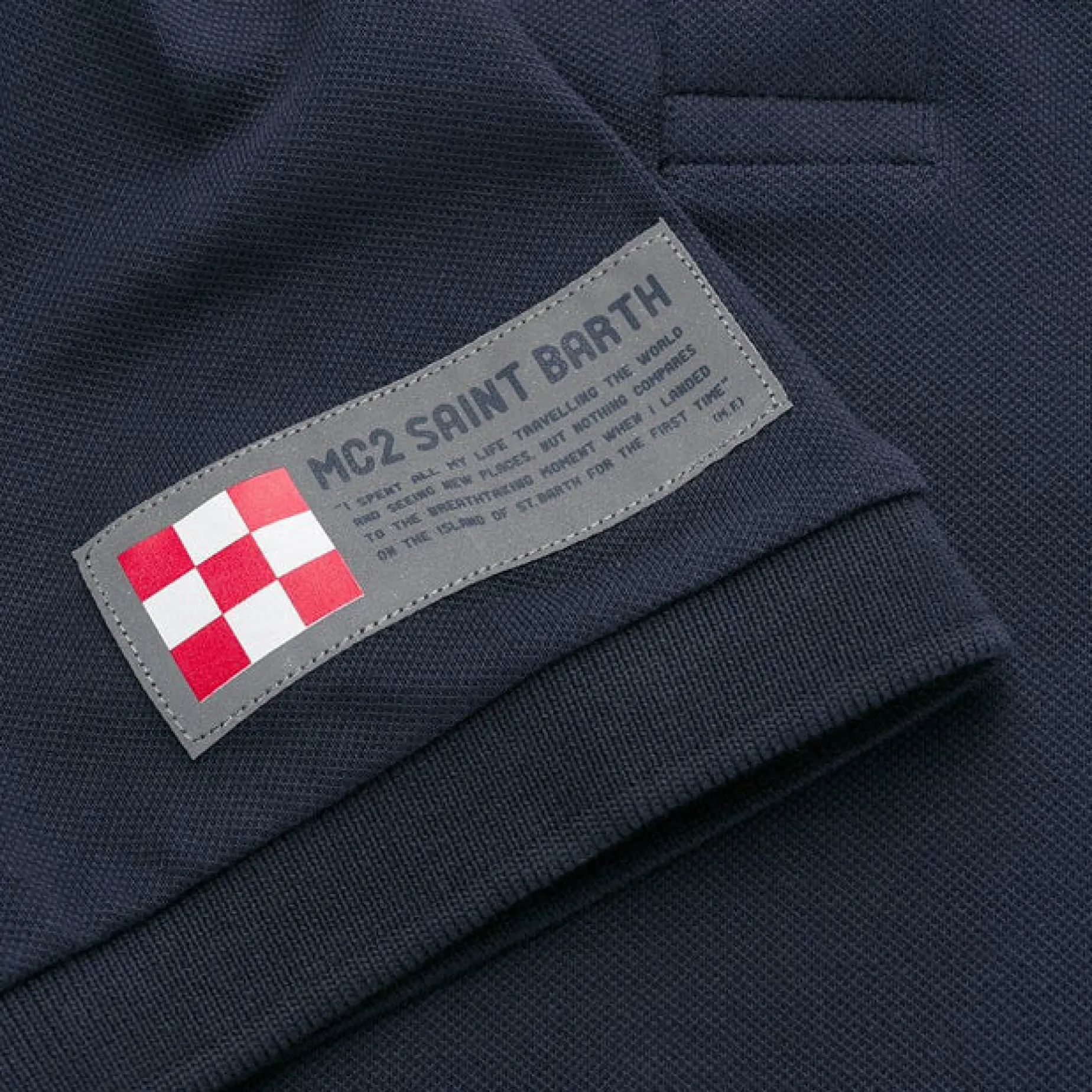 Piquet-Poloshirt für Kinder mit Stickerei vorne und Aufdruck hinten