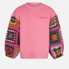 Rosa Mädchenpullover mit Häkelärmeln